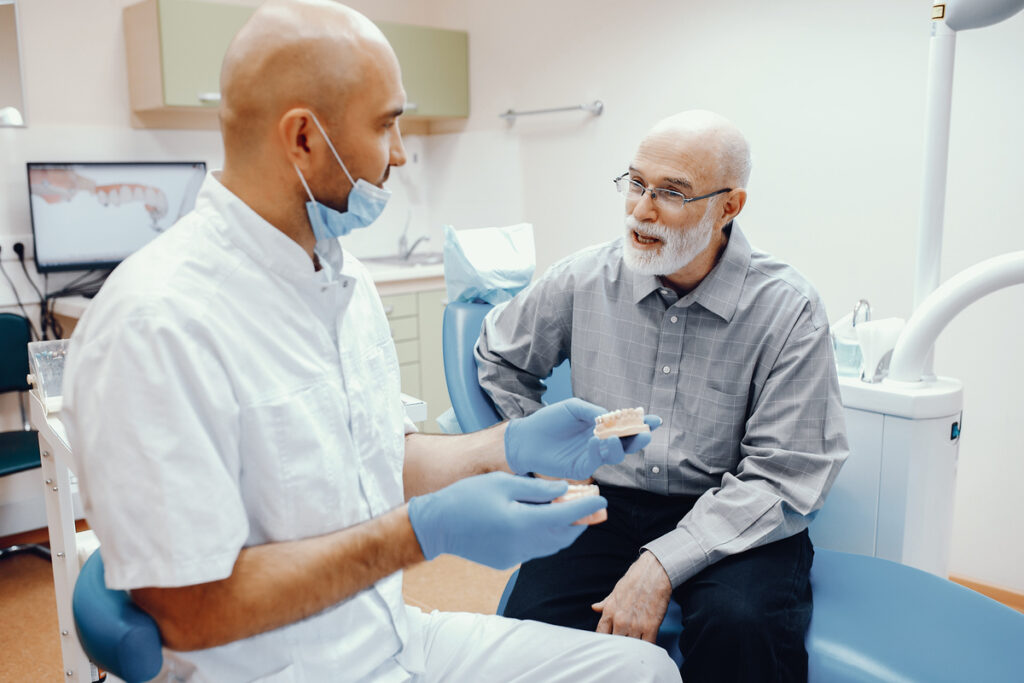 Old man sitting in the dentist's office