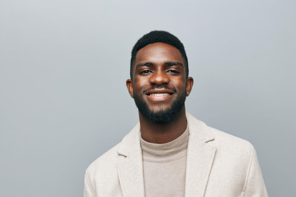 man smile smart confident isolated bald smiling emotion young jacket portrait success american african american head cheerful shot head happy enjoy black dentistry