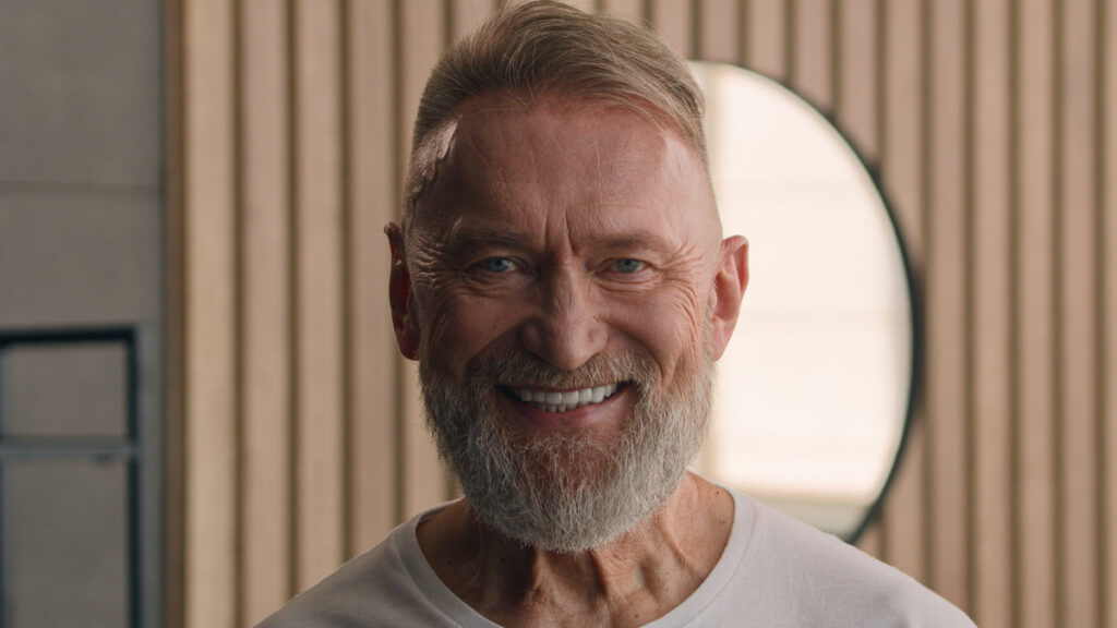Happy elderly senior Caucasian old male adult gray-haired 70s man smiling face white healthy teeth dental toothy smile indoors looking at camera grandfather at home dentistry clinic close up portrait. High quality 4k footage